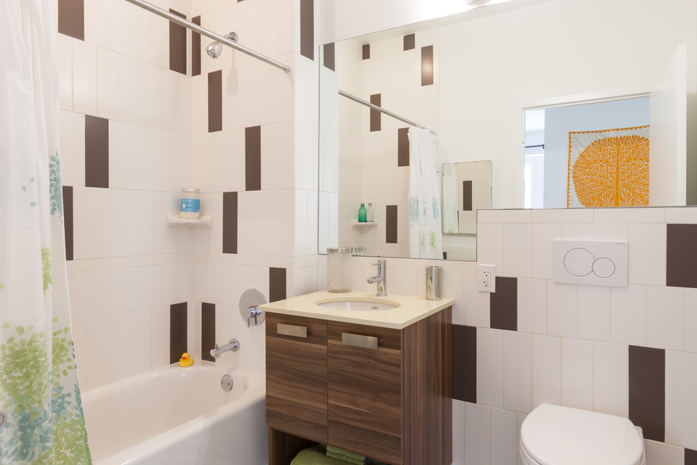 22 Caton Place, Unit 4H Brooklyn, NY 11218 - Photo 9 of 20 a bathroom with a sink toilet and shower