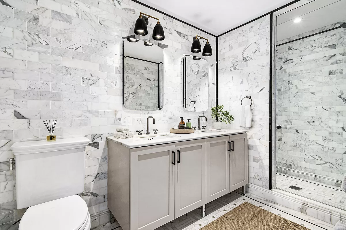 265 State Street, Unit 806 Brooklyn, NY 11201 - Photo 5 of 8 a bathroom with a sink toilet and shower