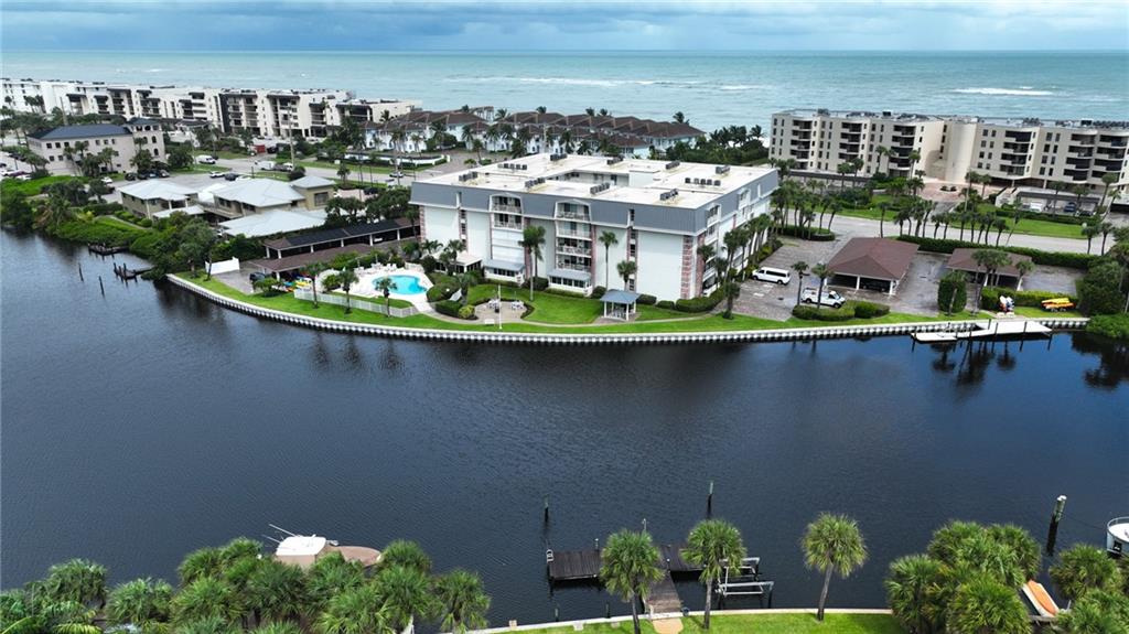 4601 Highway A1a, Unit 102 Vero Beach, FL 32963 - Photo 29 of 29 a view of a lake with tall buildings