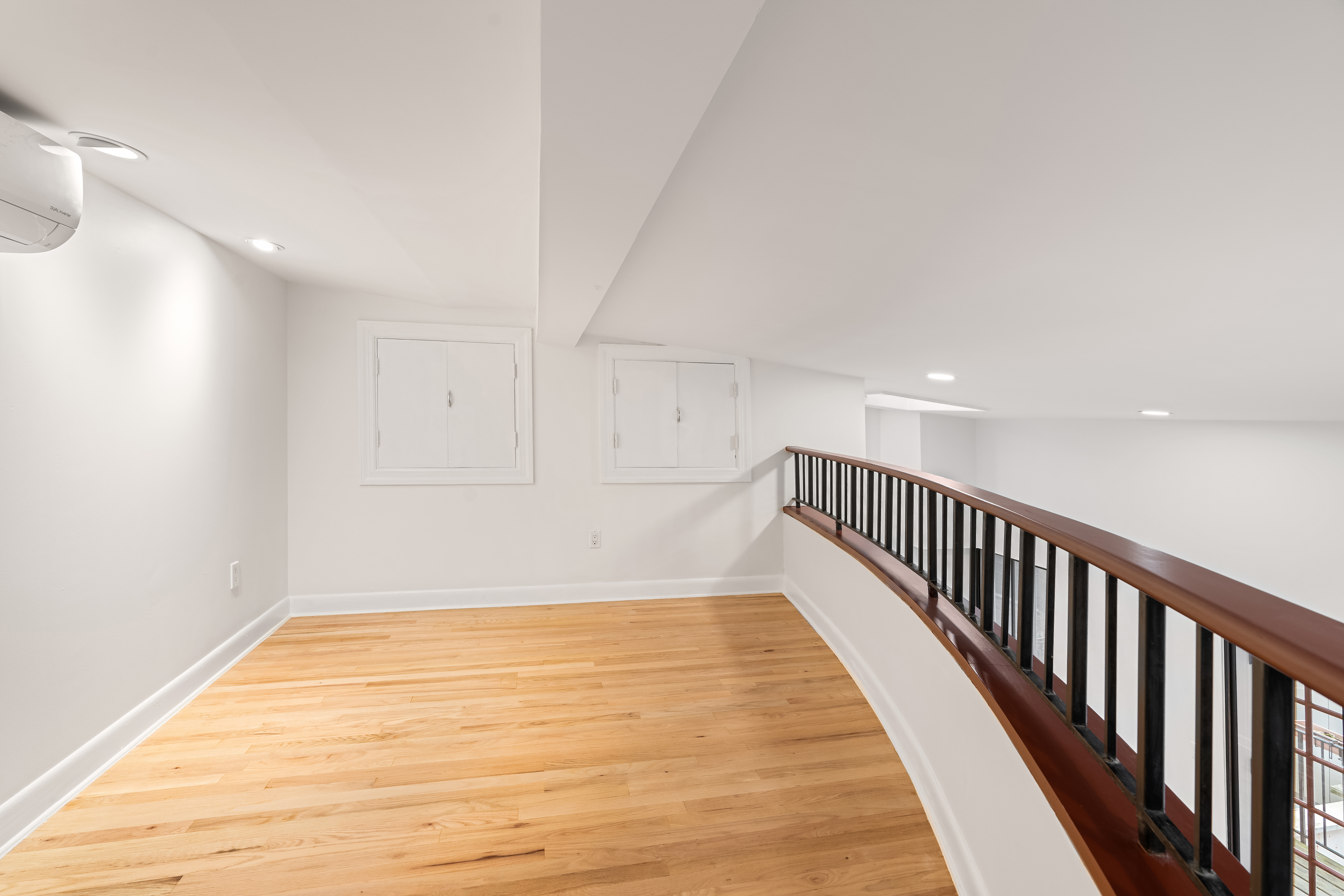 51 East 10th Street, Unit 9 Manhattan, NY 10003 - Photo 5 of 9 a view of an empty room with wooden floor