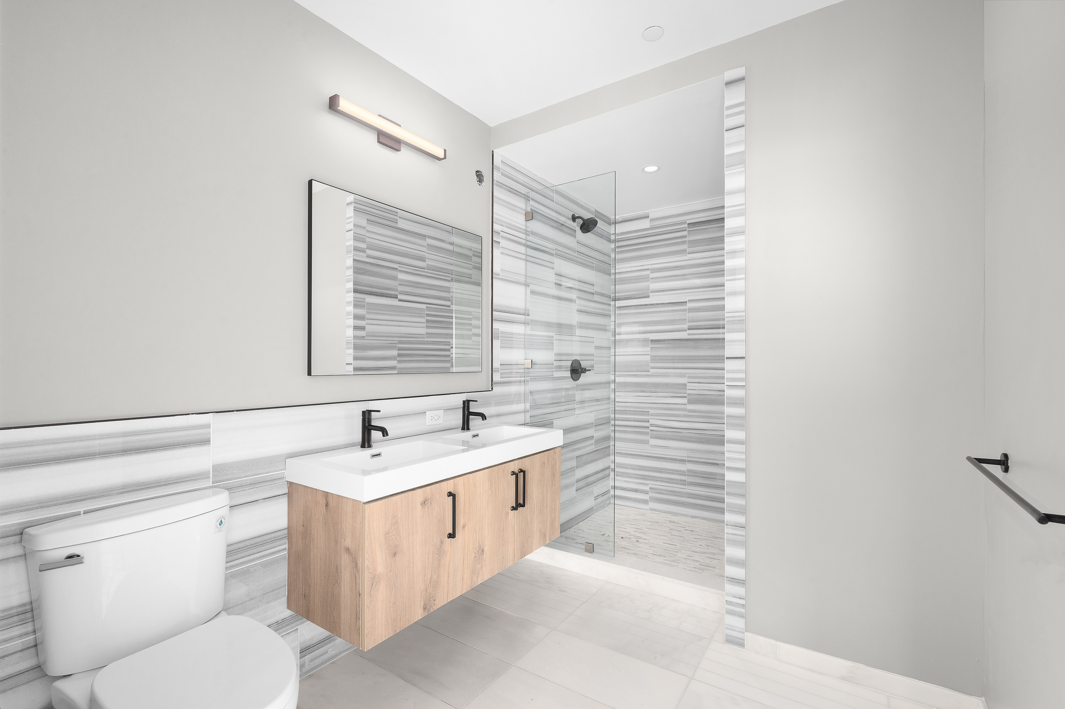 927 Atlantic Avenue, Unit 7A Brooklyn, NY 11238 - Photo 8 of 16 a bathroom with a sink a toilet and shower