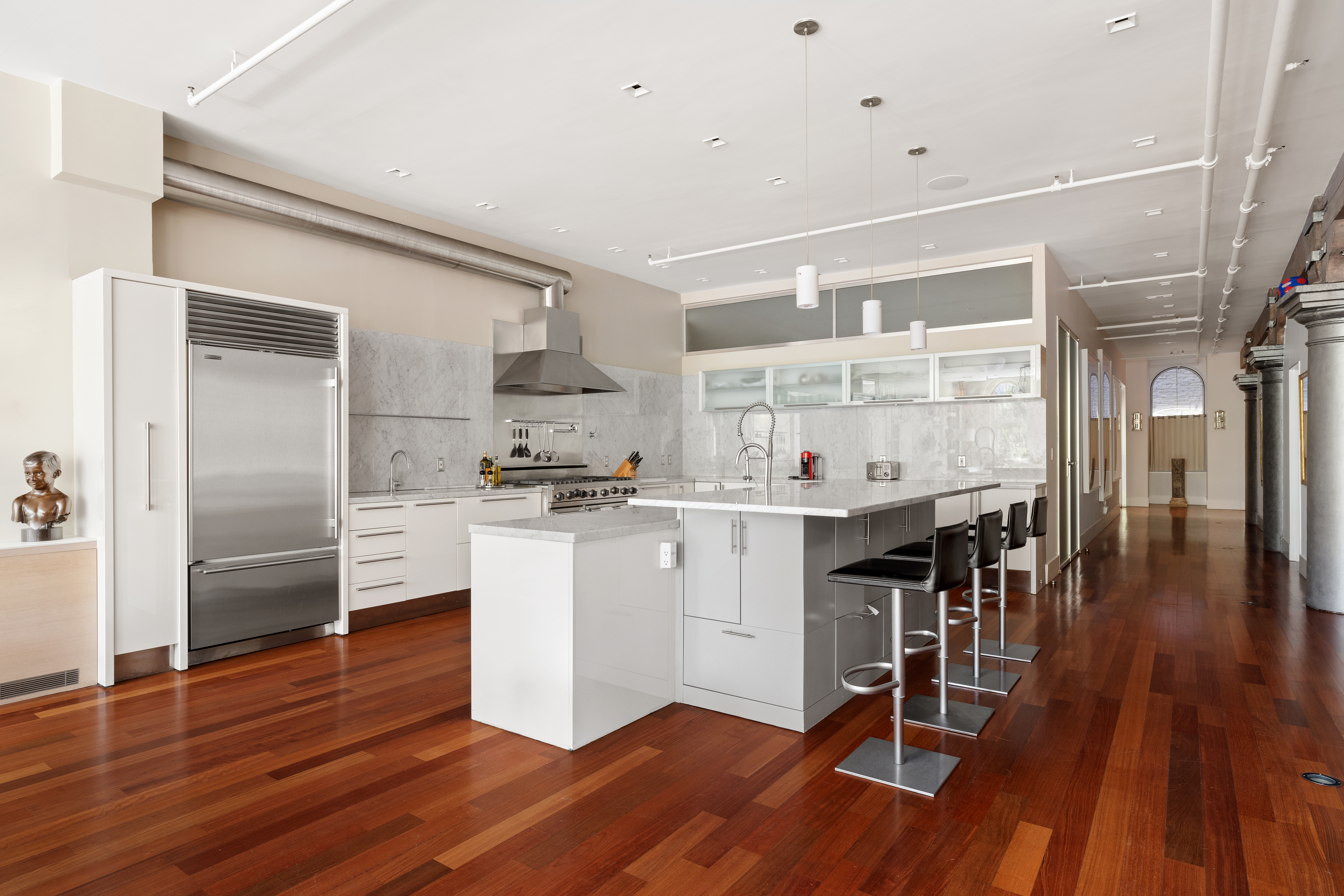 44 Laight Street, Unit 2A Manhattan, NY 10013 - Photo 8 of 28 a kitchen with a refrigerator and white cabinets