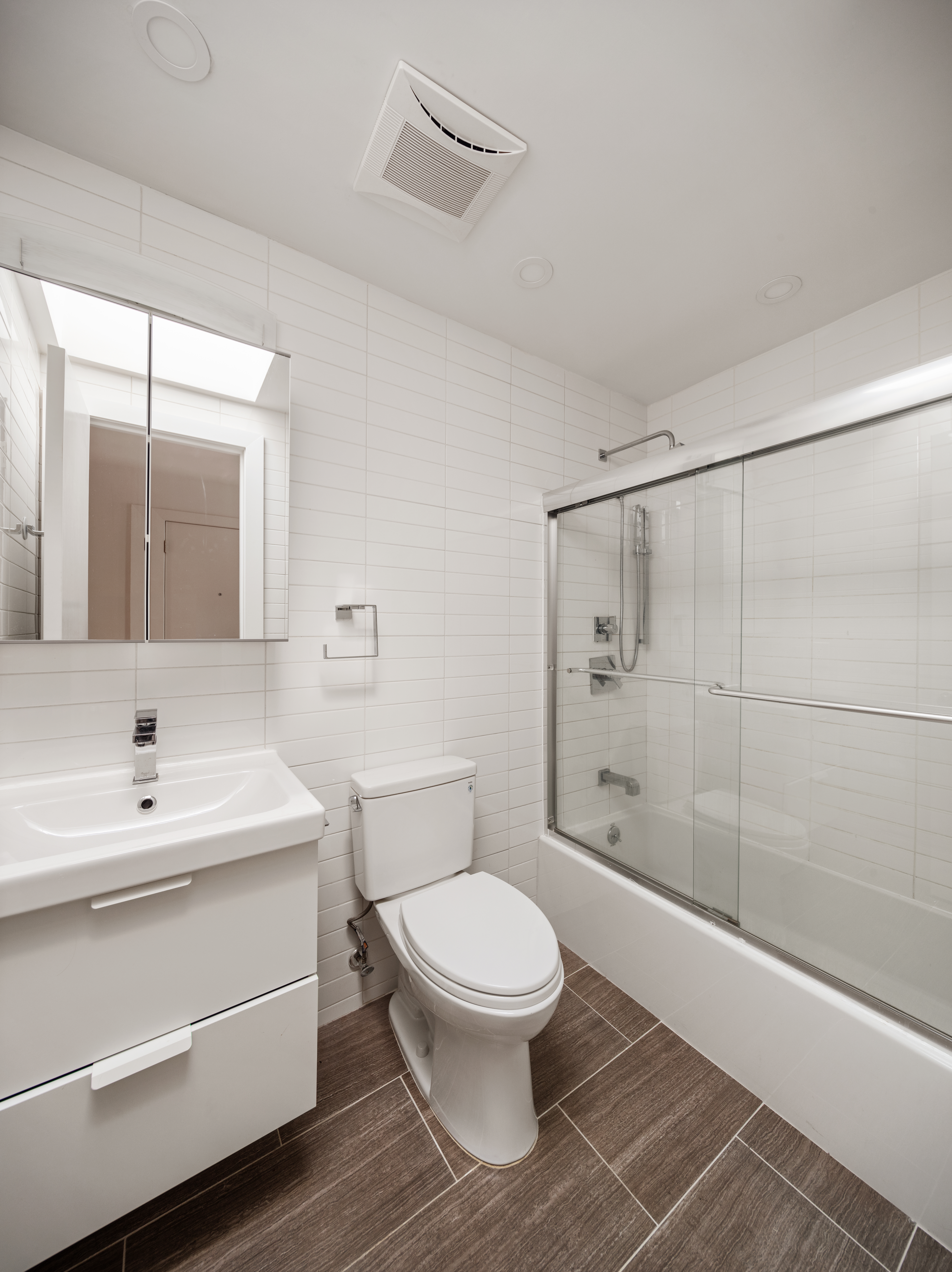 502 5th Avenue, Unit 3 Brooklyn, NY 11215 - Photo 8 of 10 a bathroom with a toilet a sink and shower