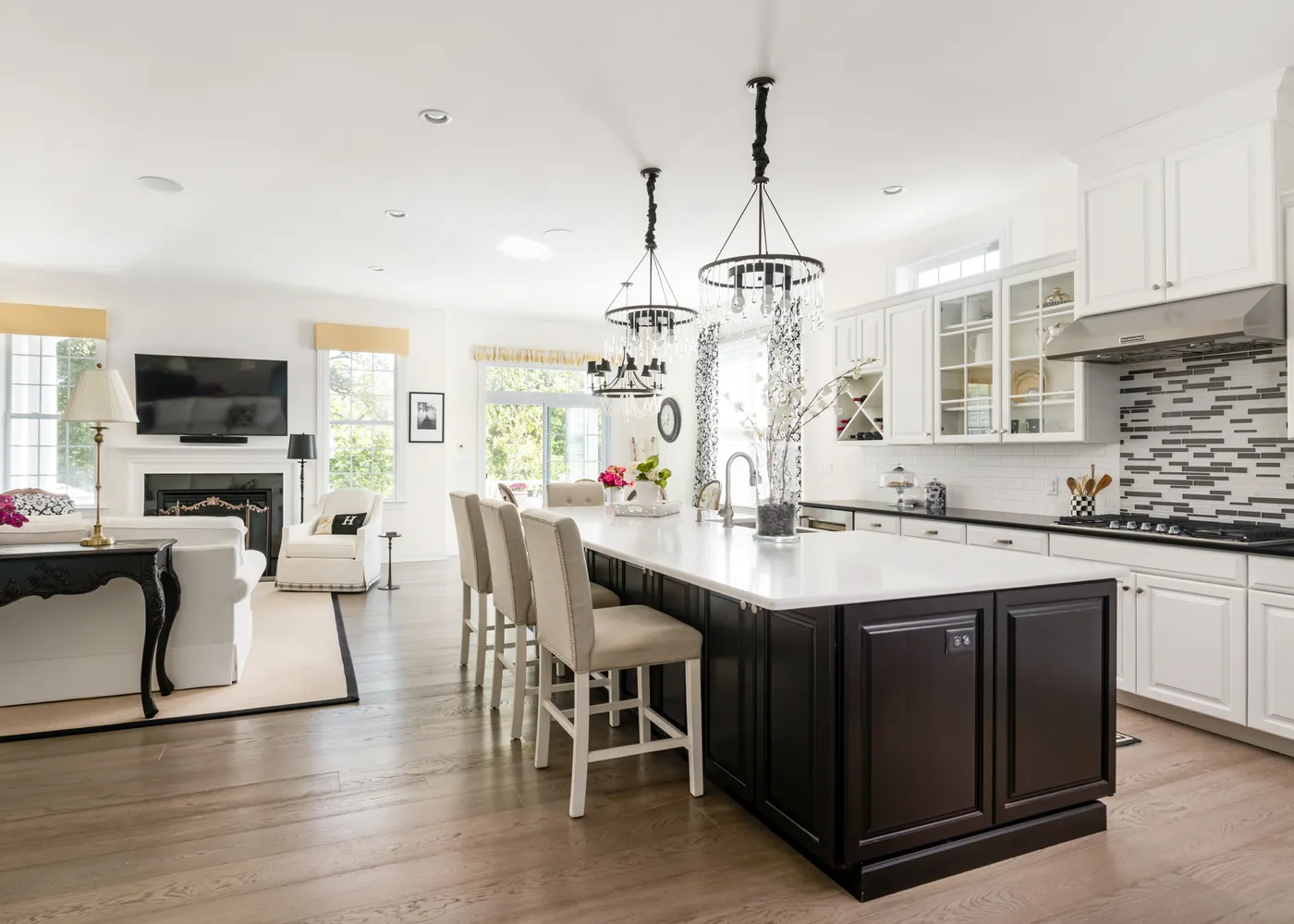 a kitchen with center island table and chairs