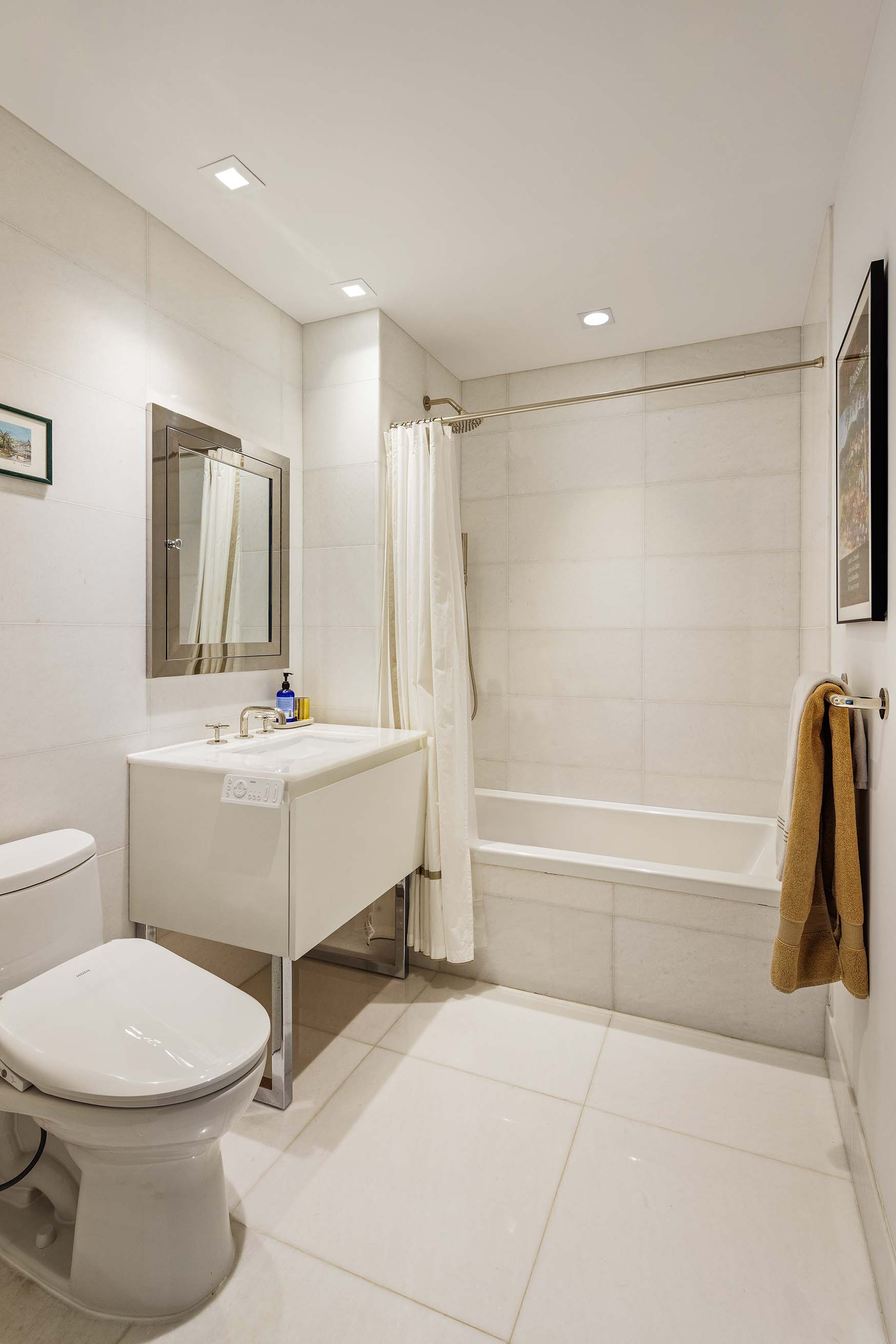 5 Franklin Place, Unit 14A Manhattan, NY 10013 - Photo 13 of 23 a bathroom with a sink toilet and shower