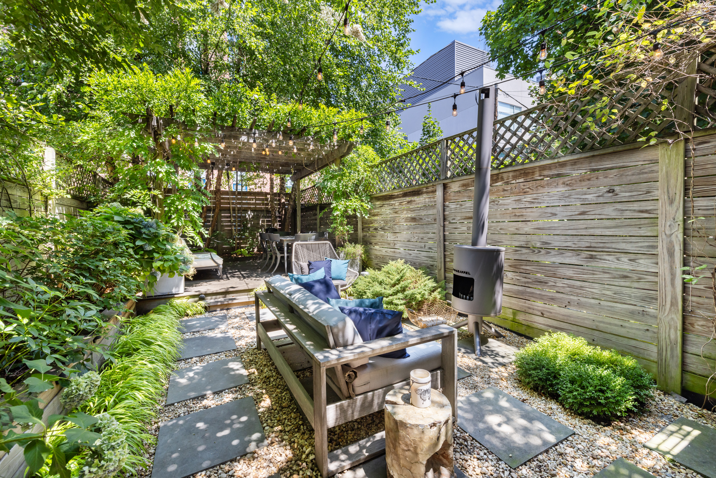 439 A Monroe Street Brooklyn, NY 11221 - Photo 24 of 29 a building outdoor space with patio furniture and potted plants