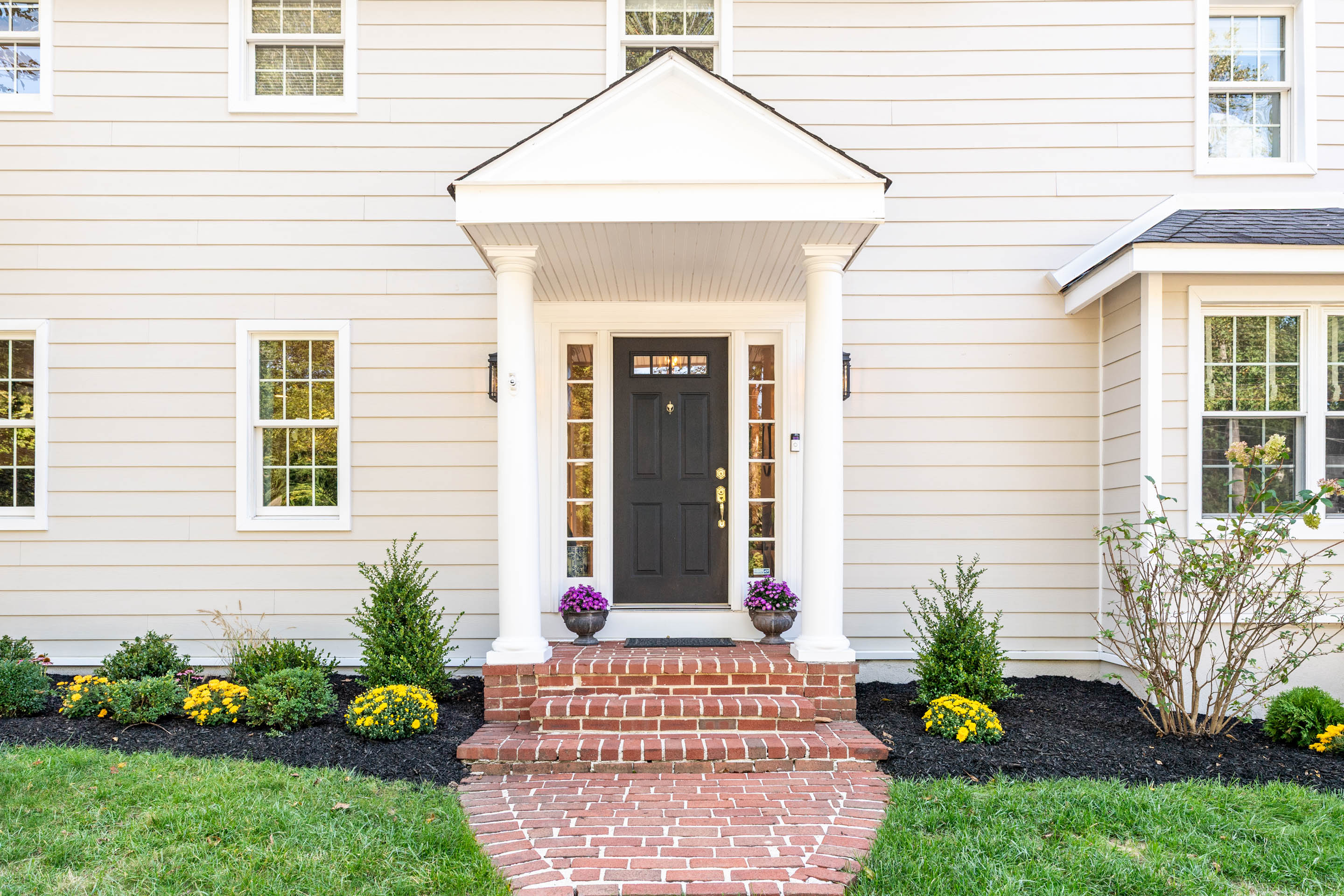 a front view of a house with a yard