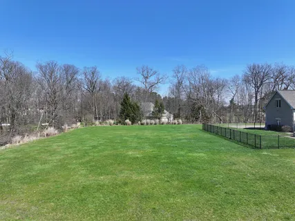 a view of a house with a big yard