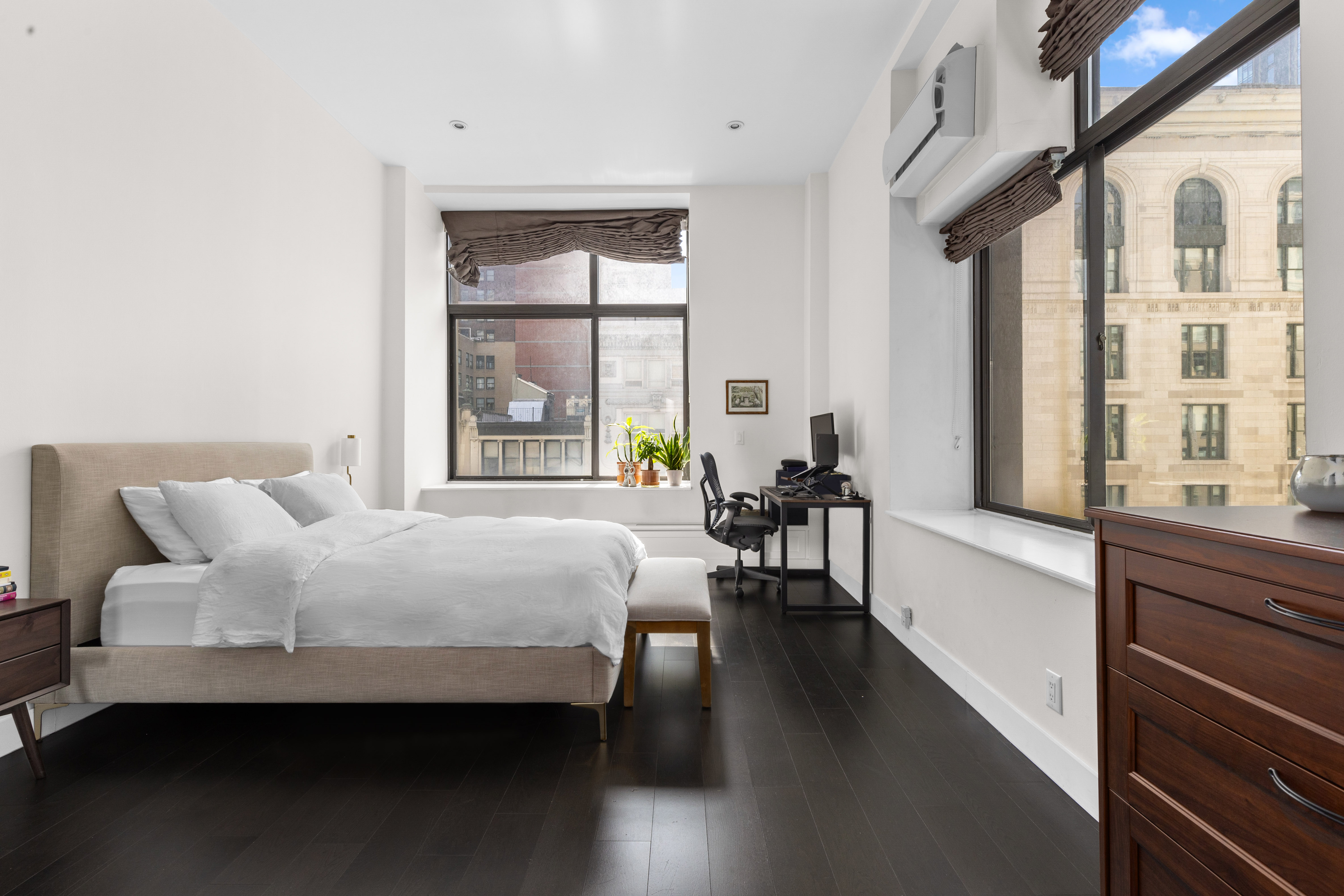 372 5th Avenue, Unit 5F Manhattan, NY 10018 - Photo 3 of 9 a bedroom with a bed and a large window with outer view