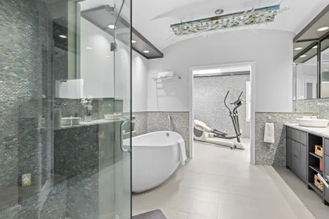 a bathroom with a sink double vanity and tub