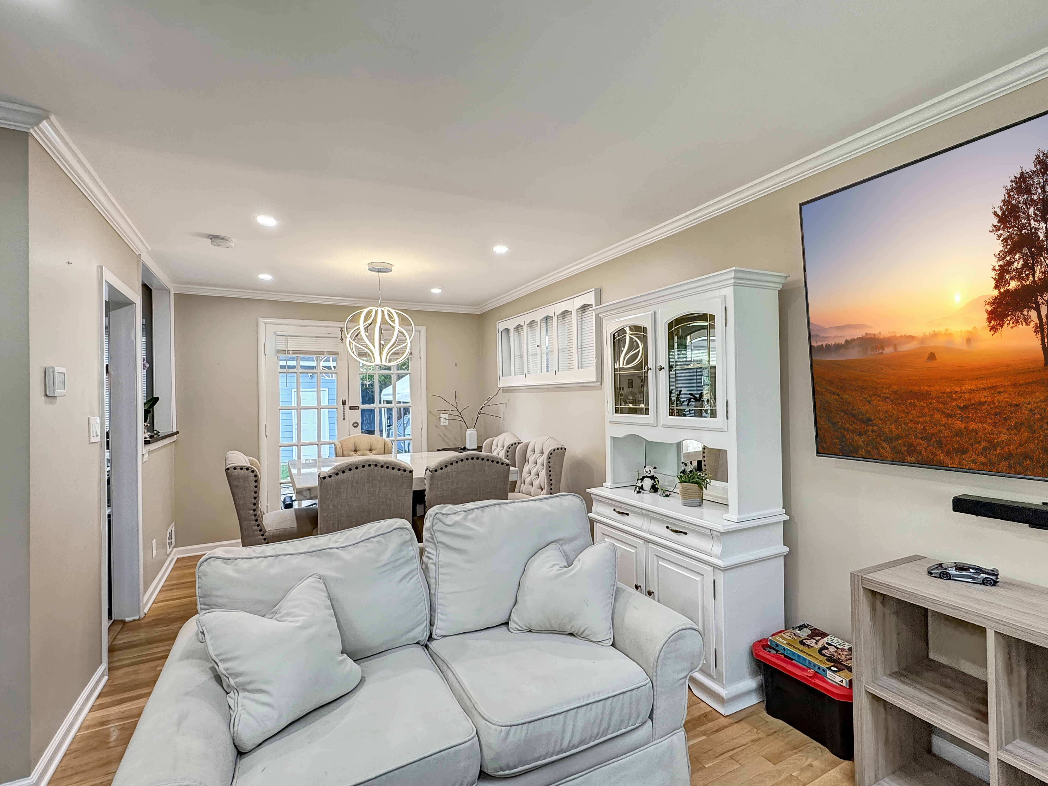 2408 Lillian Drive Silver Spring, MD 20902 - Photo 8 of 40 a living room with furniture a flat screen tv and a floor to ceiling window