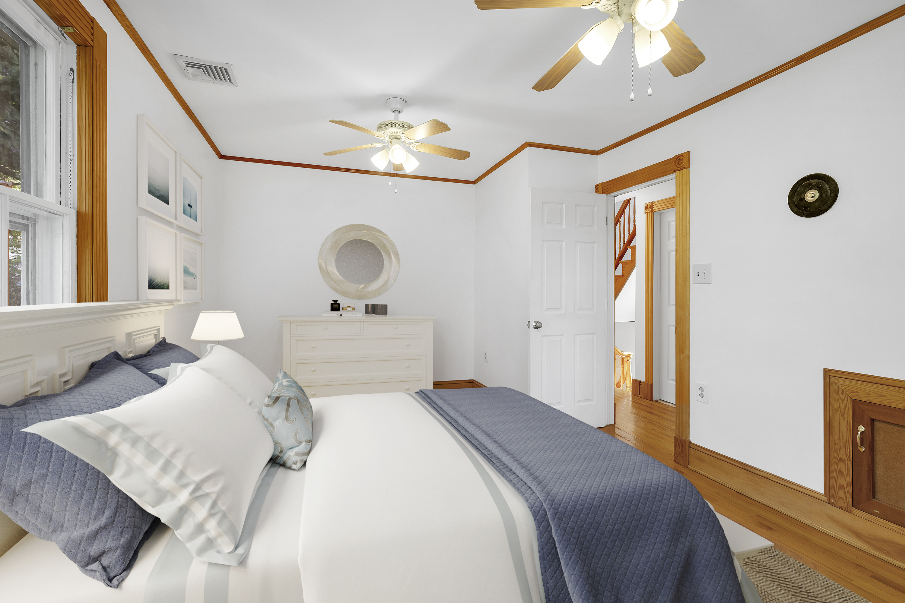 242-09 Pine Street Queens, NY 11363 - Photo 5 of 21 a bedroom with a bed and a chandelier