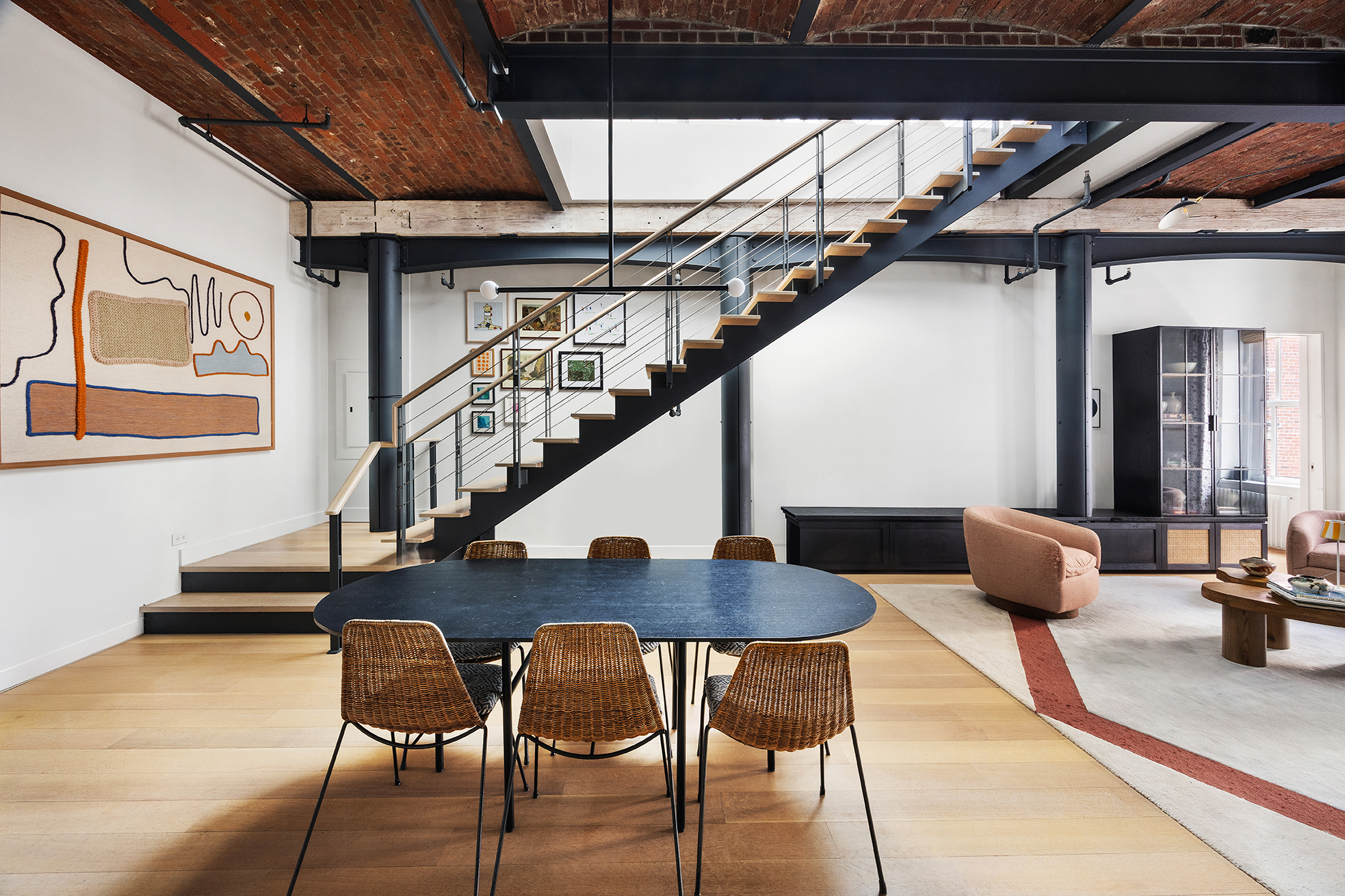 63 Greene Street, Unit PHB Manhattan, NY 10012 - Photo 2 of 17 a dining room with furniture and wooden floor