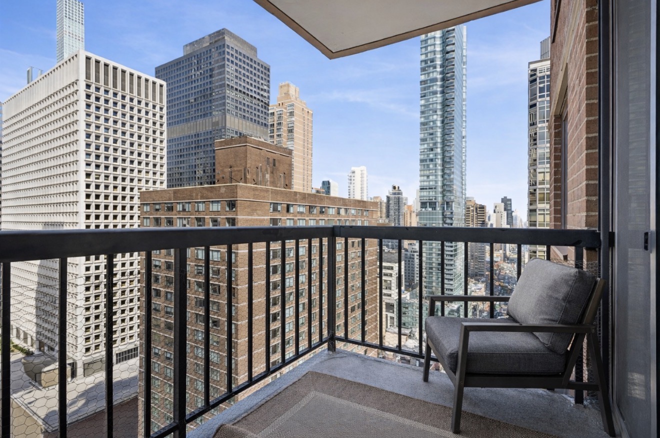 300 East 54th Street, Unit 29H Manhattan, NY 10022 - Photo 2 of 14 a view of a balcony with a couch