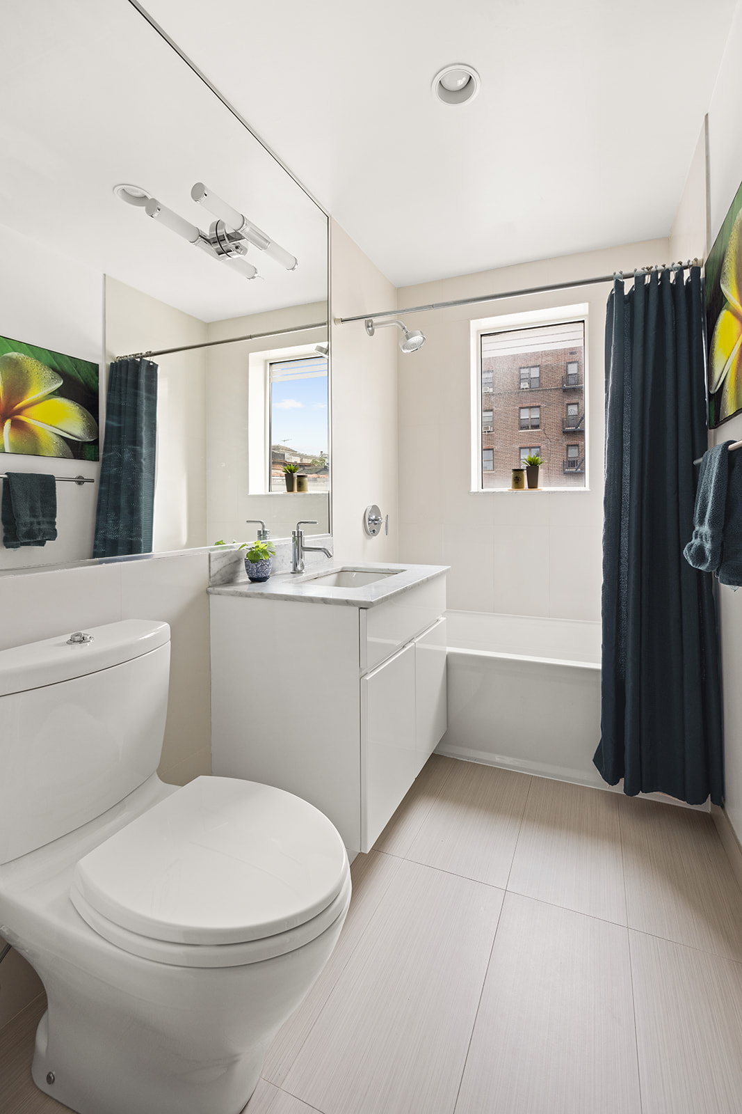 823 Classon Avenue, Unit 4B Brooklyn, NY 11238 - Photo 6 of 17 a bathroom with a sink a toilet and shower
