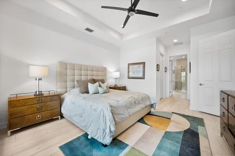 a bedroom with a bed and a book shelf