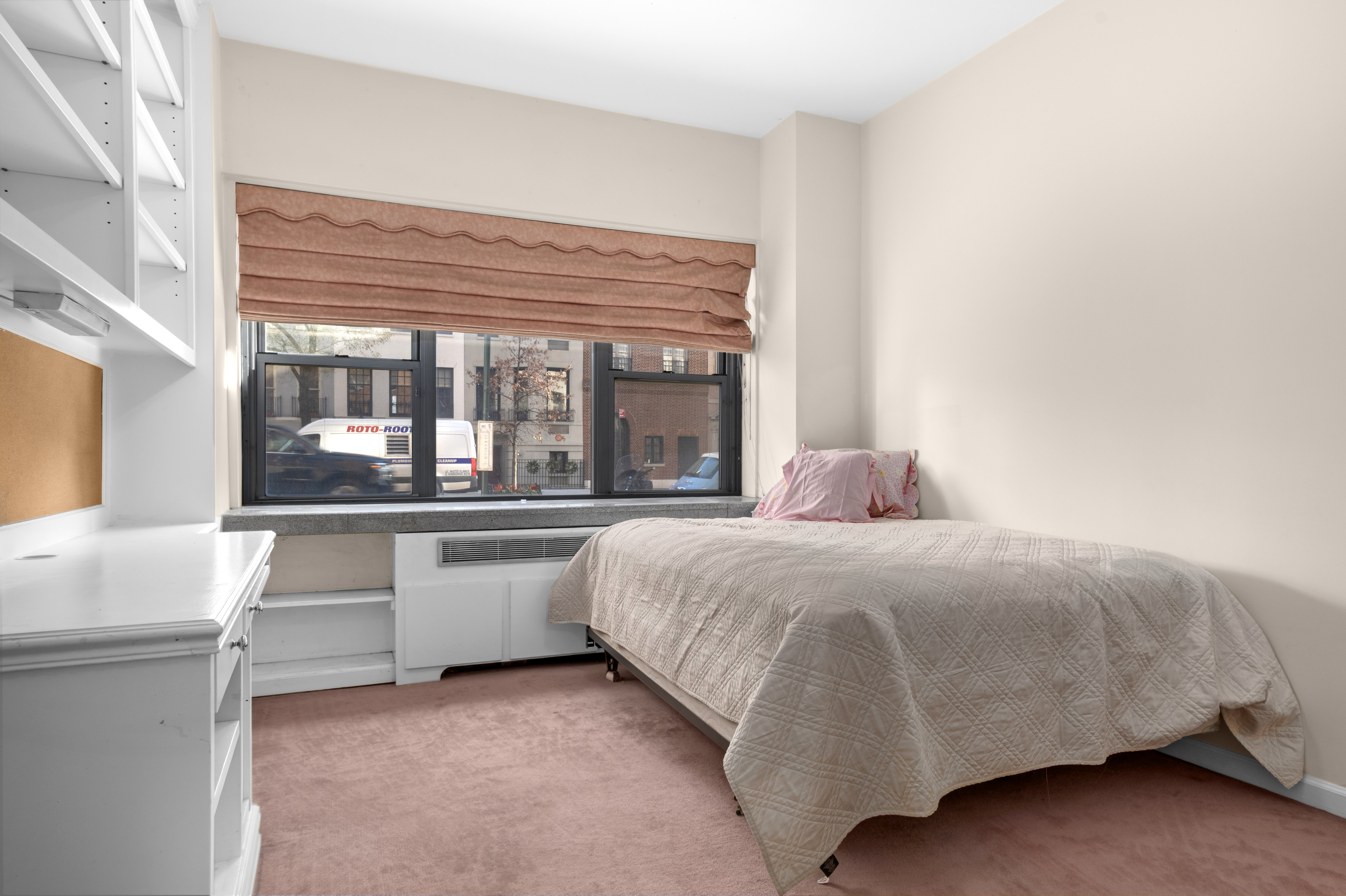 16 Sutton Place, Unit 1A/1B Manhattan, NY 10022 - Photo 19 of 25 a bedroom with a bed and a large window