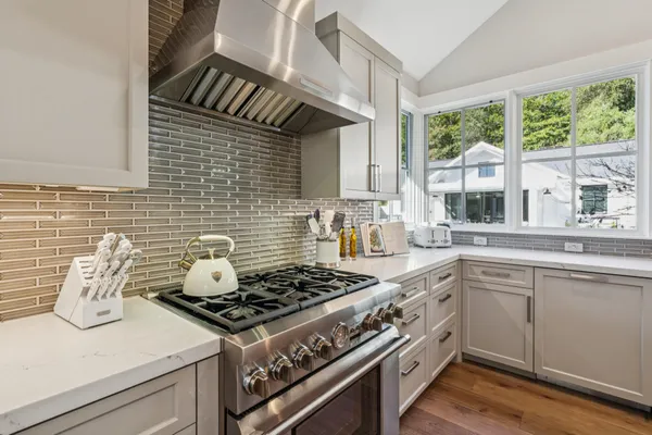 a kitchen with a sink and large window