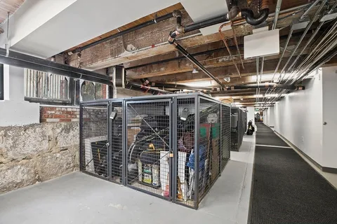a brick building with a street sign