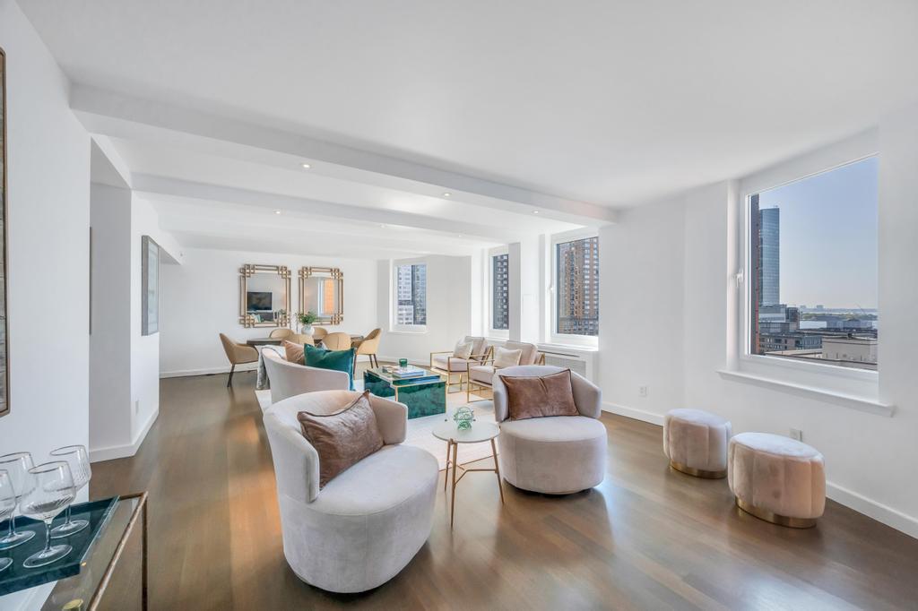 333 Rector Place, Unit PH6S Manhattan, NY 10280 - Photo 3 of 26 a living room with furniture and a wooden floor