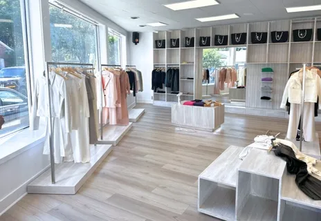 a living room with furniture fireplace and wooden floor