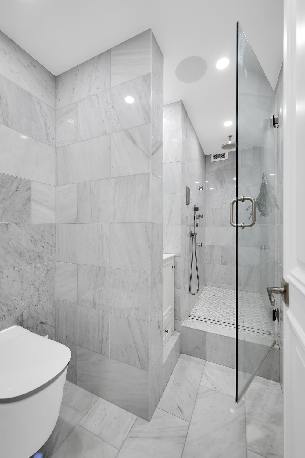 415 East 37th Street, Unit 9JK Manhattan, NY 10016 - Photo 14 of 28 a bathroom with a toilet and a shower