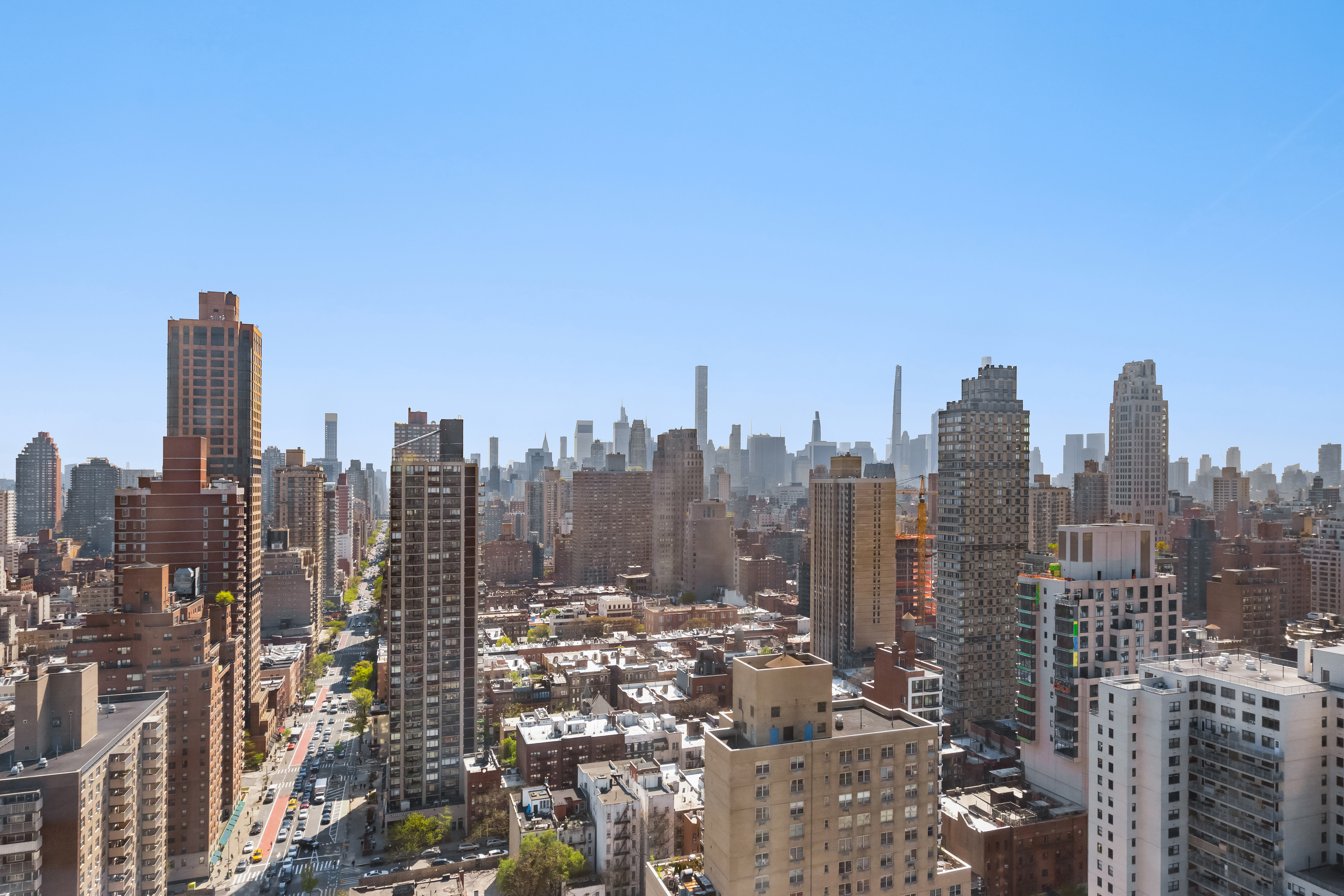 360 East 88th Street, Unit 31C Manhattan, NY 10128 - Photo 2 of 24 a view of a city with tall buildings in the background
