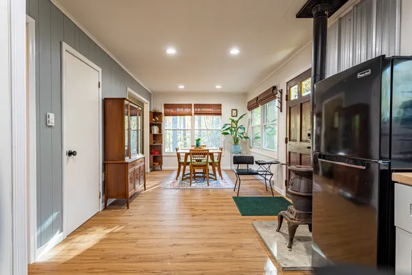a bedroom with a bed and a view of living room