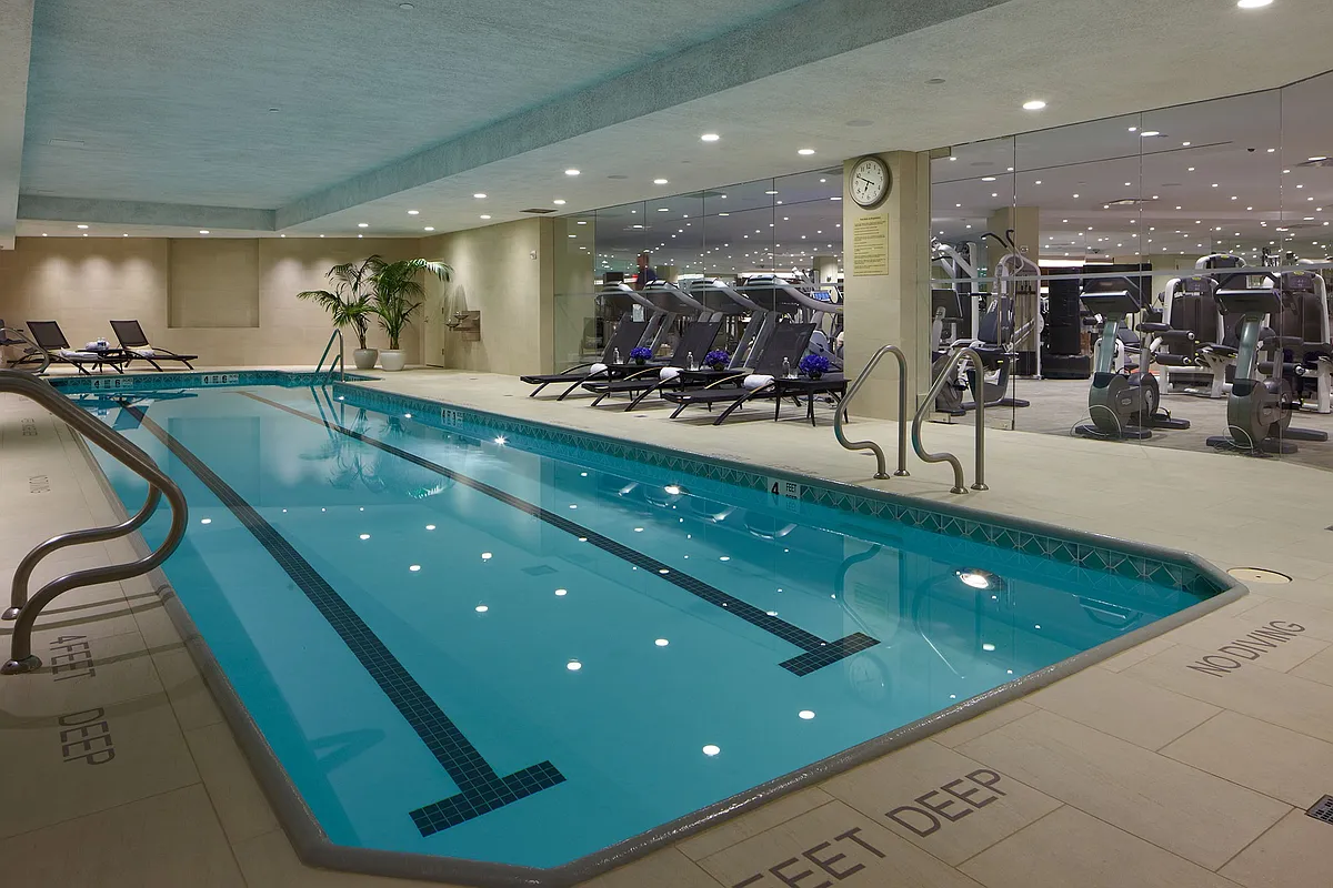 1 Central Park West, Unit 1218 Manhattan, NY 10023 - Photo 7 of 11 a large swimming pool is in a large room