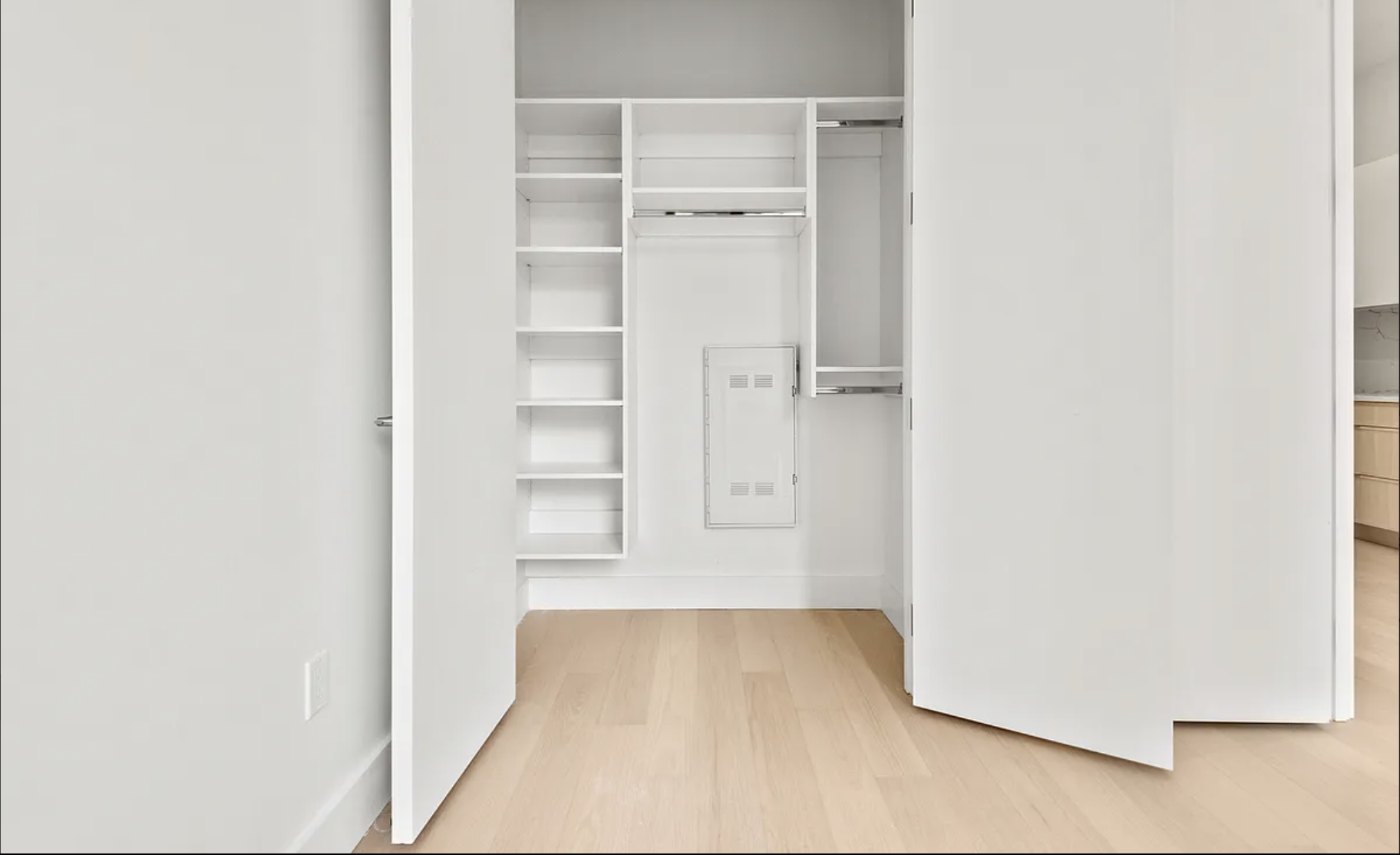 218 Front Street, Unit 184 Brooklyn, NY 11201 - Photo 5 of 13 a view of an empty walk in closet with wooden floor