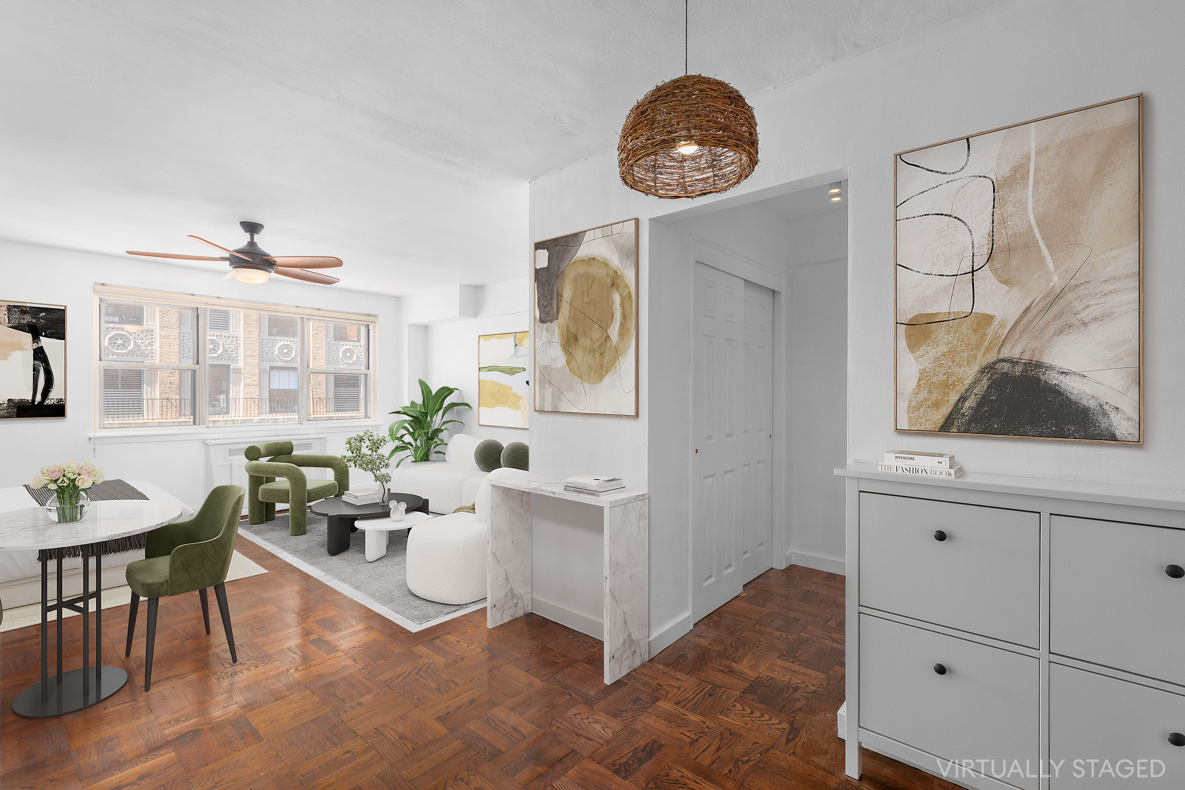 139 East 33rd Street, Unit 15G Manhattan, NY 10016 - Photo 5 of 11 a living room with furniture a clock and a window