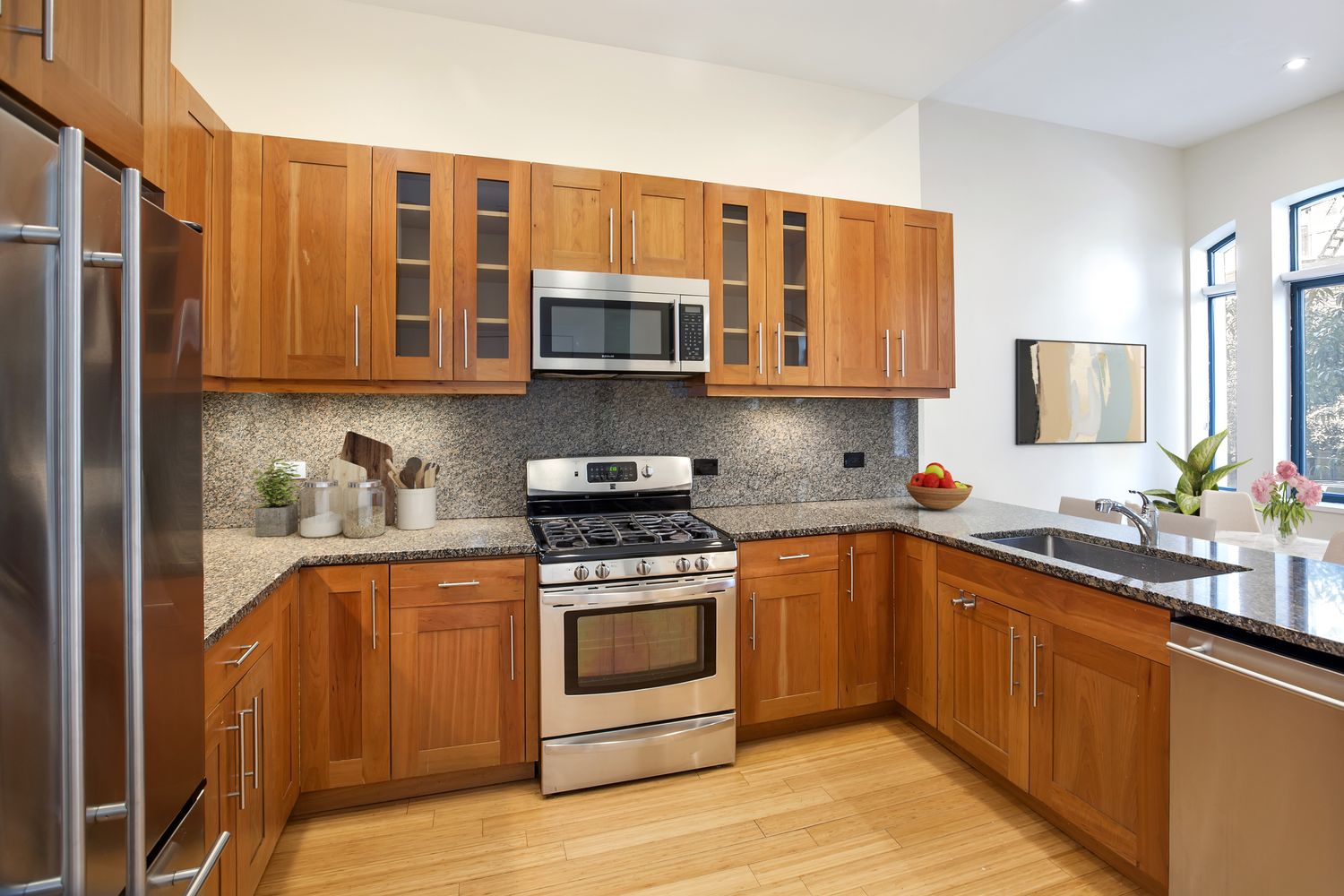 2056 5th Avenue, Unit 2B Manhattan, NY 10035 - Photo 3 of 13 a kitchen with stainless steel appliances granite countertop a stove a sink dishwasher and a refrigerator