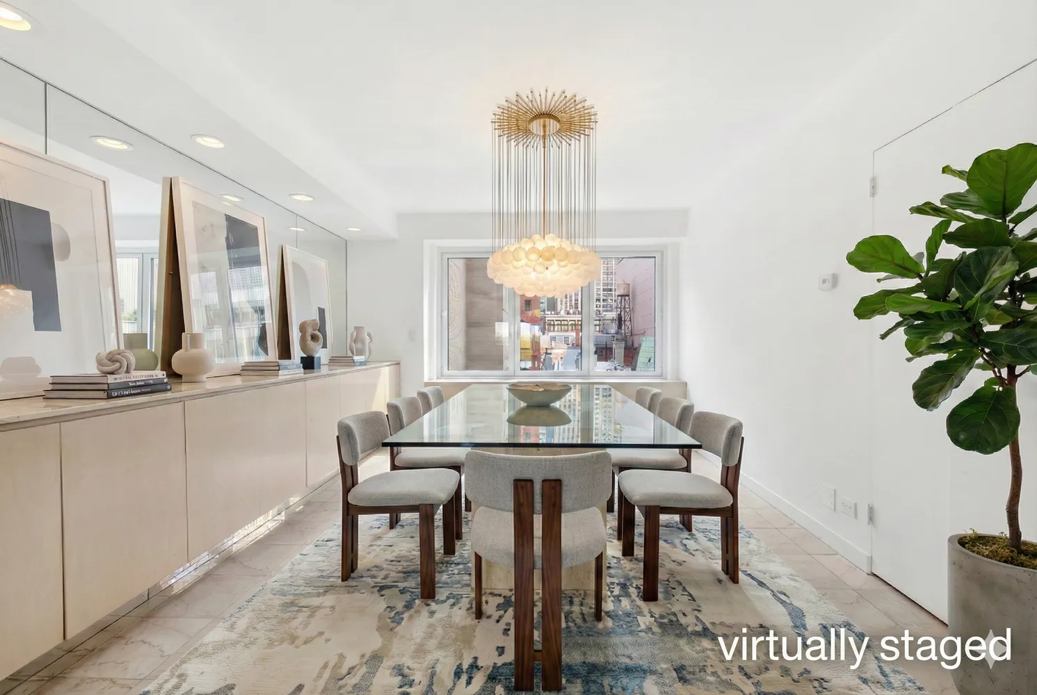 a view of a dining room with furniture and a potted plant
