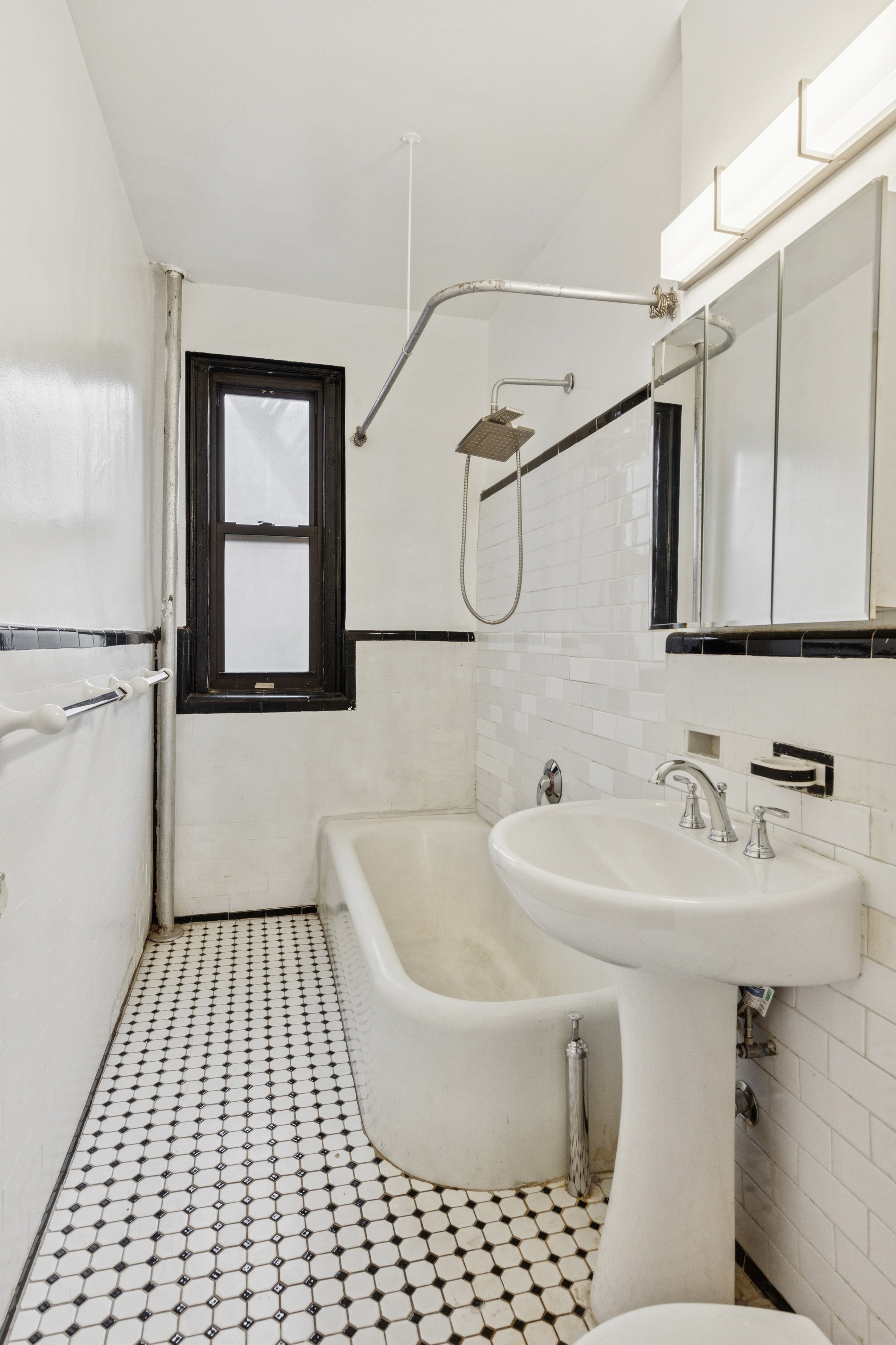 115 Cabrini Boulevard, Unit B51 Manhattan, NY 10033 - Photo 15 of 23 a bathroom with a sink and a mirror