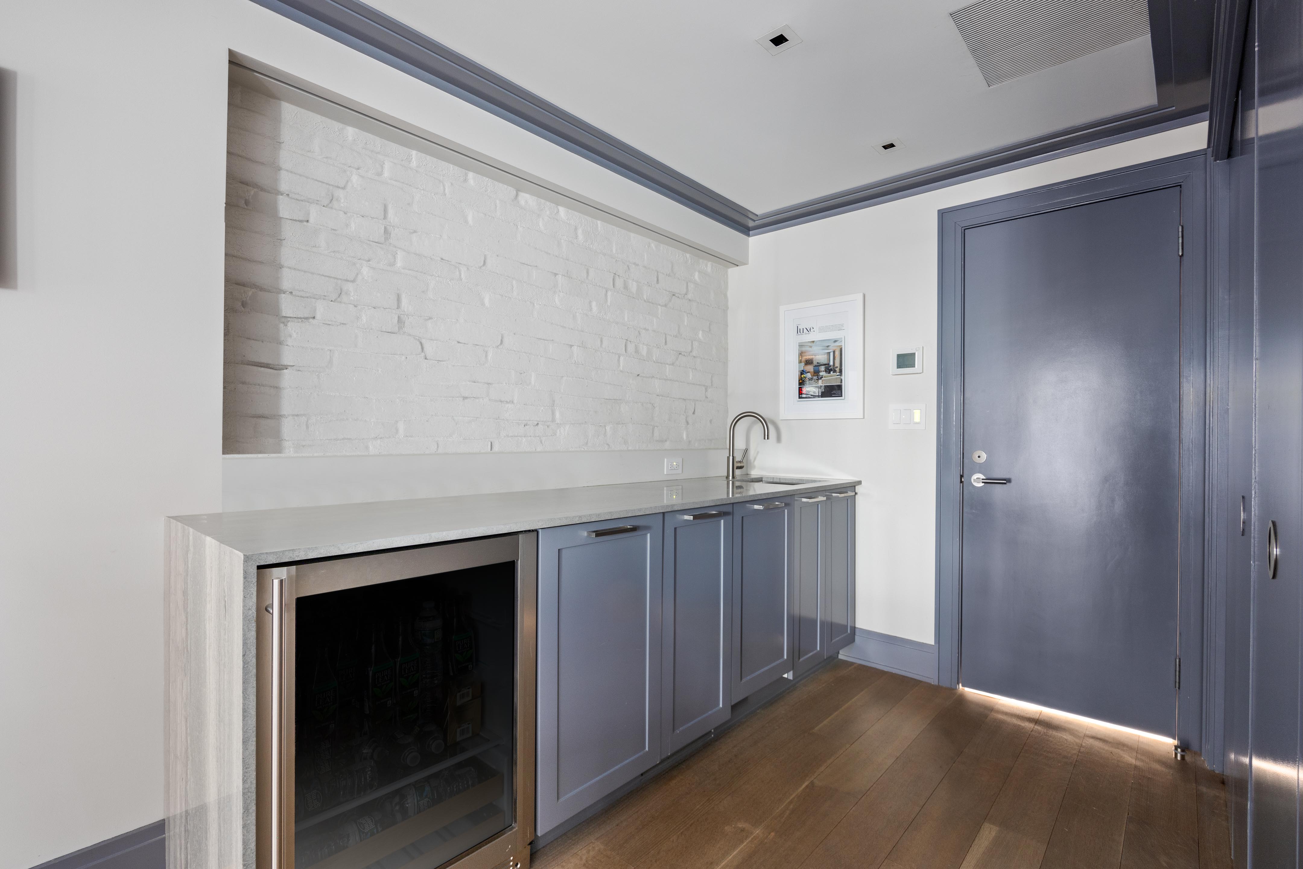 14 West 11th Street, Unit GARDEN Manhattan, NY 10011 - Photo 14 of 18 a kitchen with a sink and a mirror