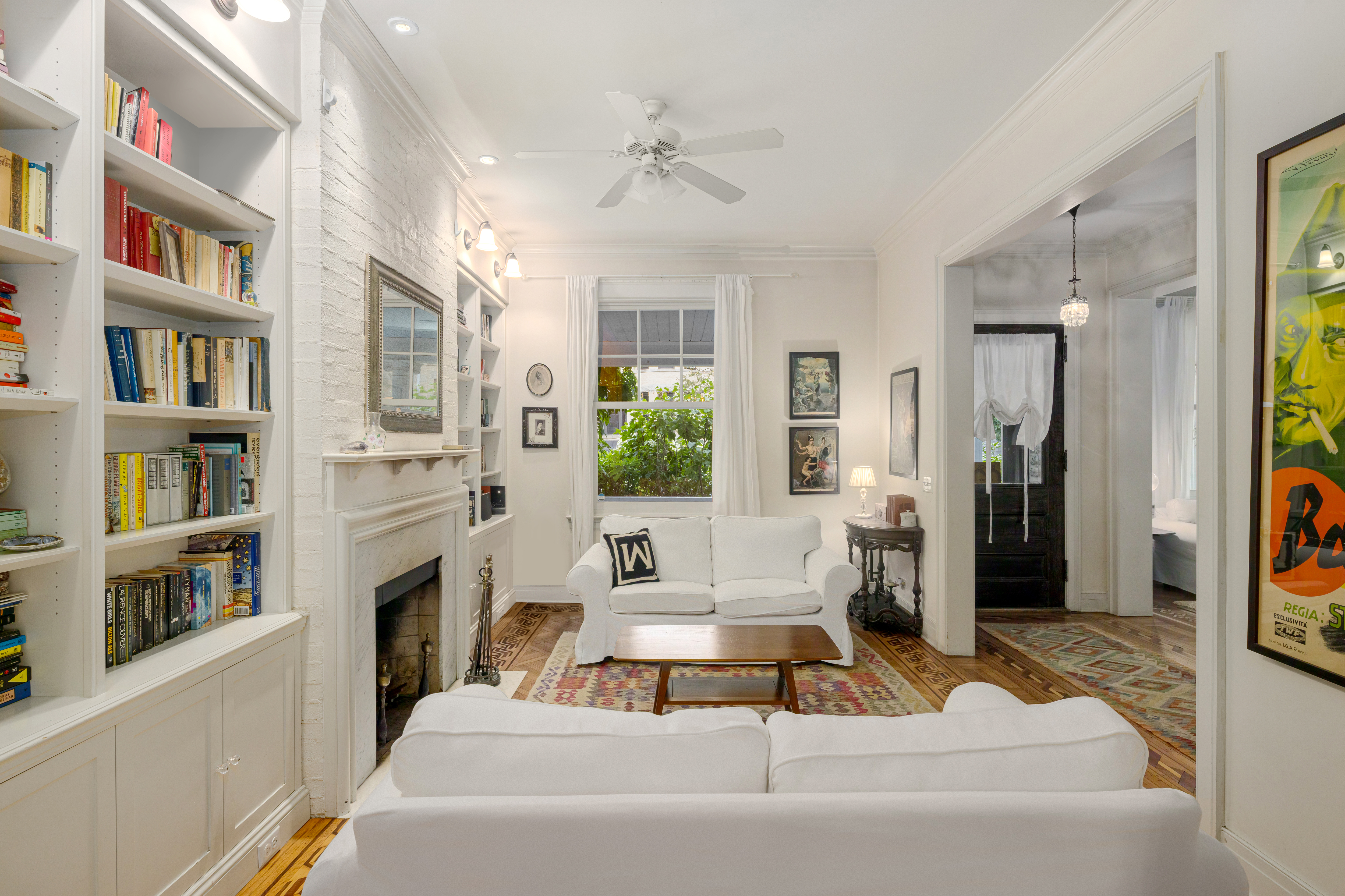 200 Fenimore Street Brooklyn, NY 11225 - Photo 6 of 24 a living room with fireplace furniture and a book shelf