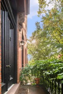 a view of a house with a tree
