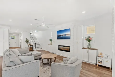 a living room with furniture and a fireplace