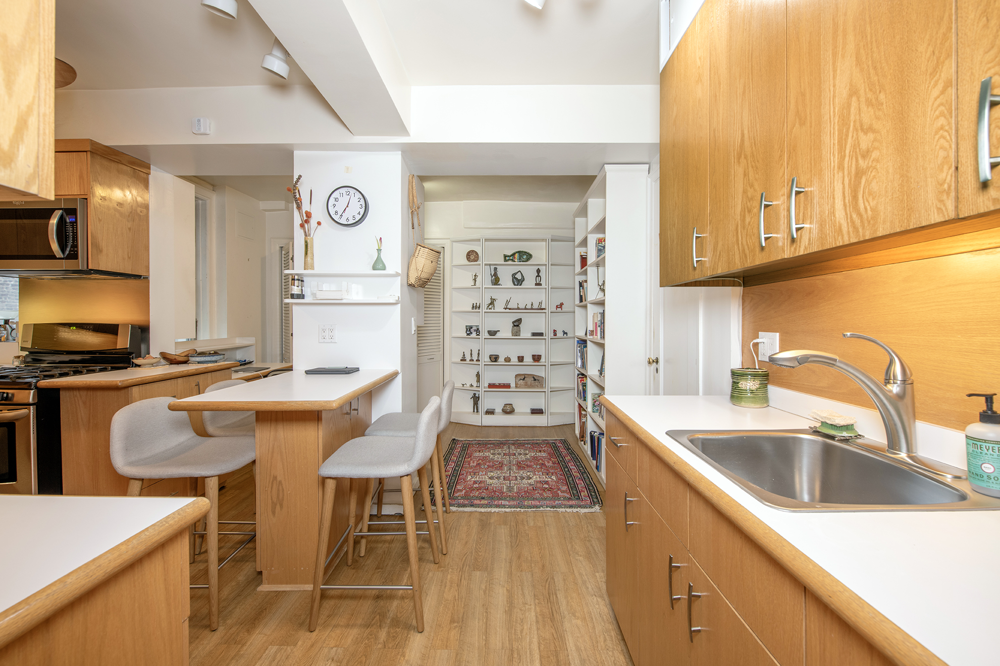 12 West 96th Street, Unit 16A Manhattan, NY 10025 - Photo 5 of 13 a kitchen with stainless steel appliances granite countertop a sink and a stove