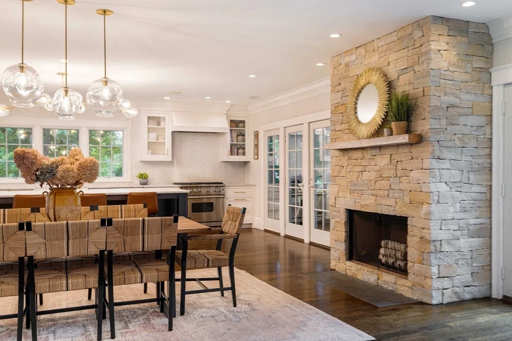 a dining room with furniture and a fireplace