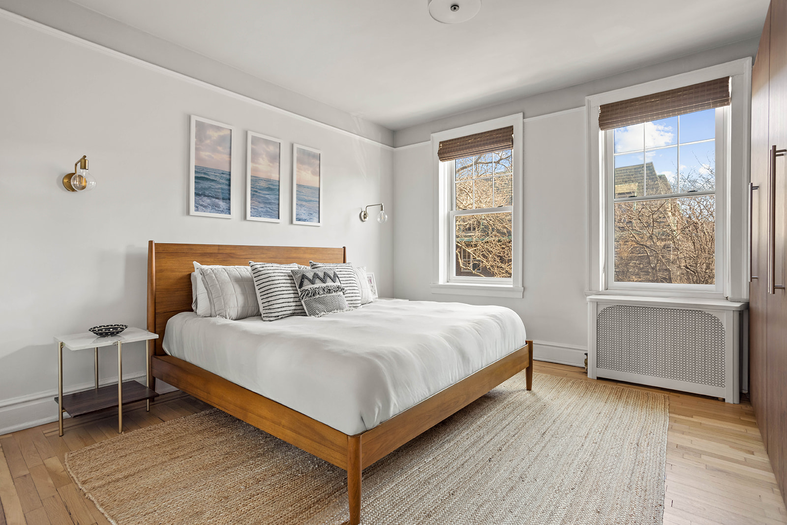 34-28 80th Street, Unit 41 Queens, NY 11372 - Photo 8 of 15 a bedroom with a bed and wooden floor