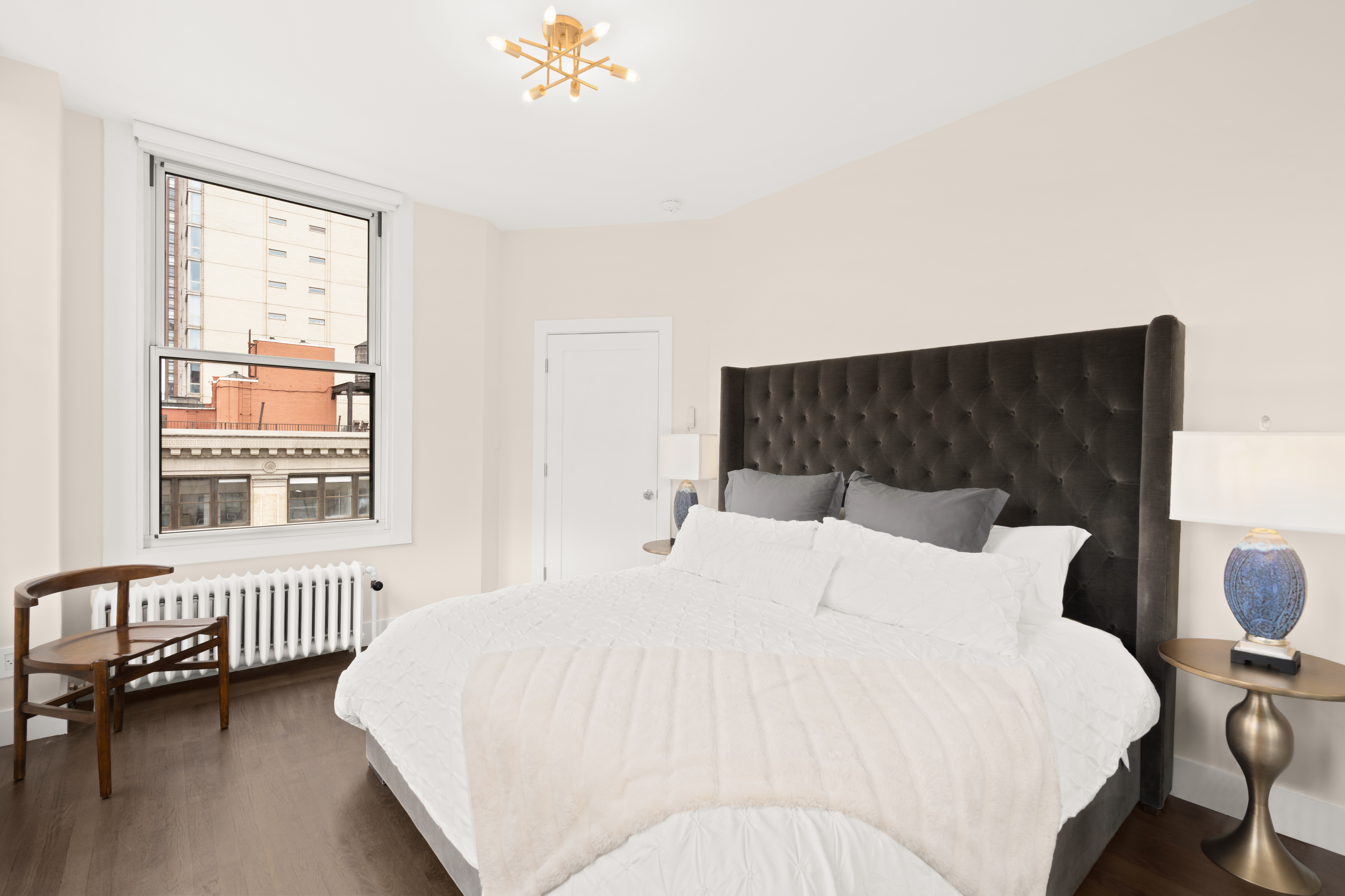 425 Park Avenue South, Unit 20B Manhattan, NY 10016 - Photo 3 of 8 a bedroom with a bed and a window