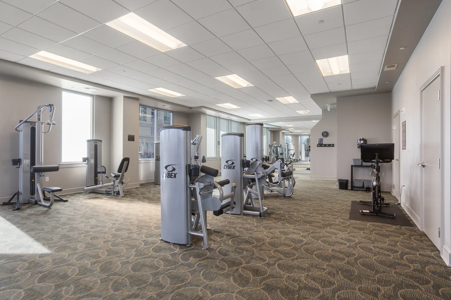 a very nice looking room with a large window and chandelier