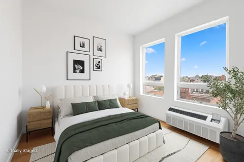 a bedroom with a bed and a couch