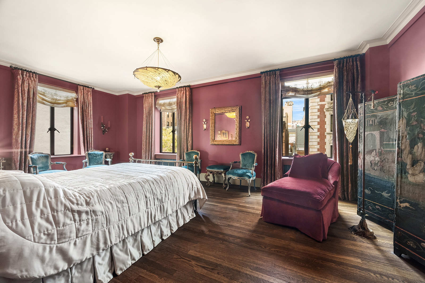145-146 Central Park West, Unit 5G Manhattan, NY 10023 - Photo 10 of 18 a bedroom with a bed and a chandelier