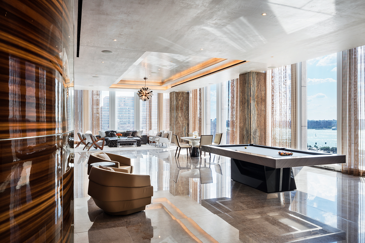 35 Hudson Yards, Unit 6201 Manhattan, NY 10001 - Photo 17 of 32 a room with lots of furniture and a large window