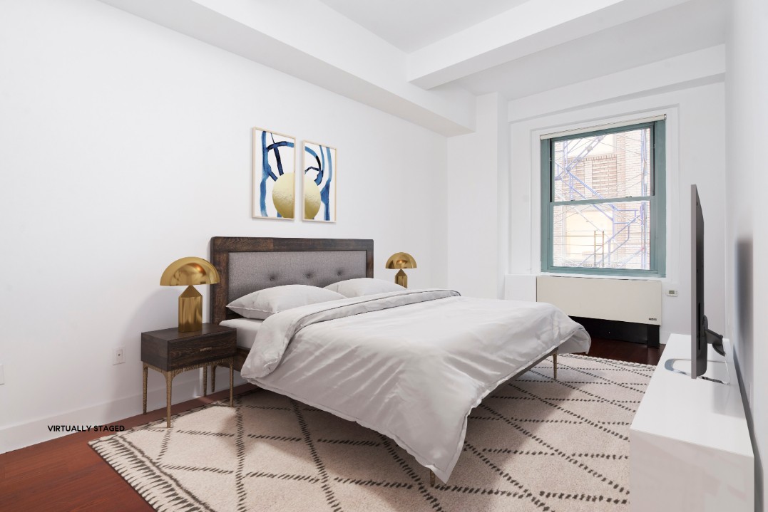 80 John Street, Unit 4C Manhattan, NY 10038 - Photo 5 of 11 a bedroom with a bed and a window