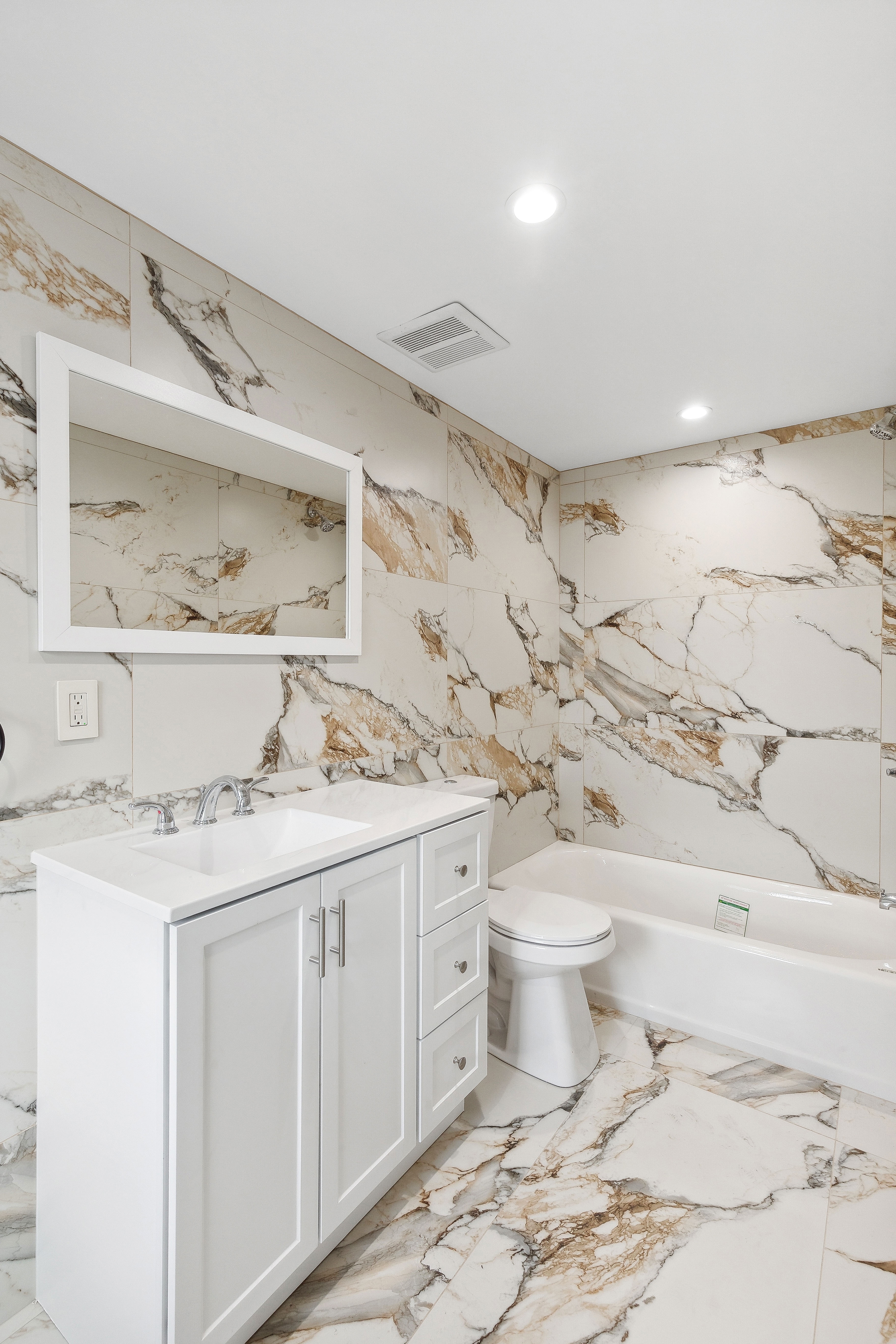 63 Devoe Street, Unit 3 Brooklyn, NY 11211 - Photo 6 of 7 a bathroom with a sink a toilet and a mirror