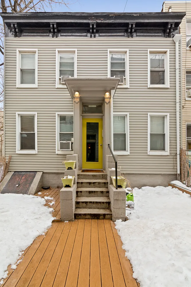 a front view of a house with a outdoor space