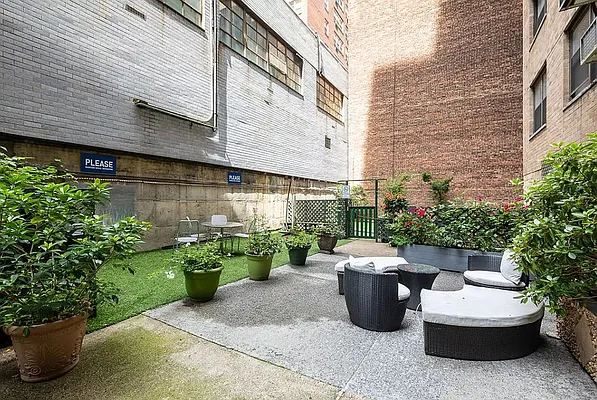 150 East 56th Street, Unit 2A Manhattan, NY 10022 - Photo 9 of 10 a view of a patio with plants and chairs and plants